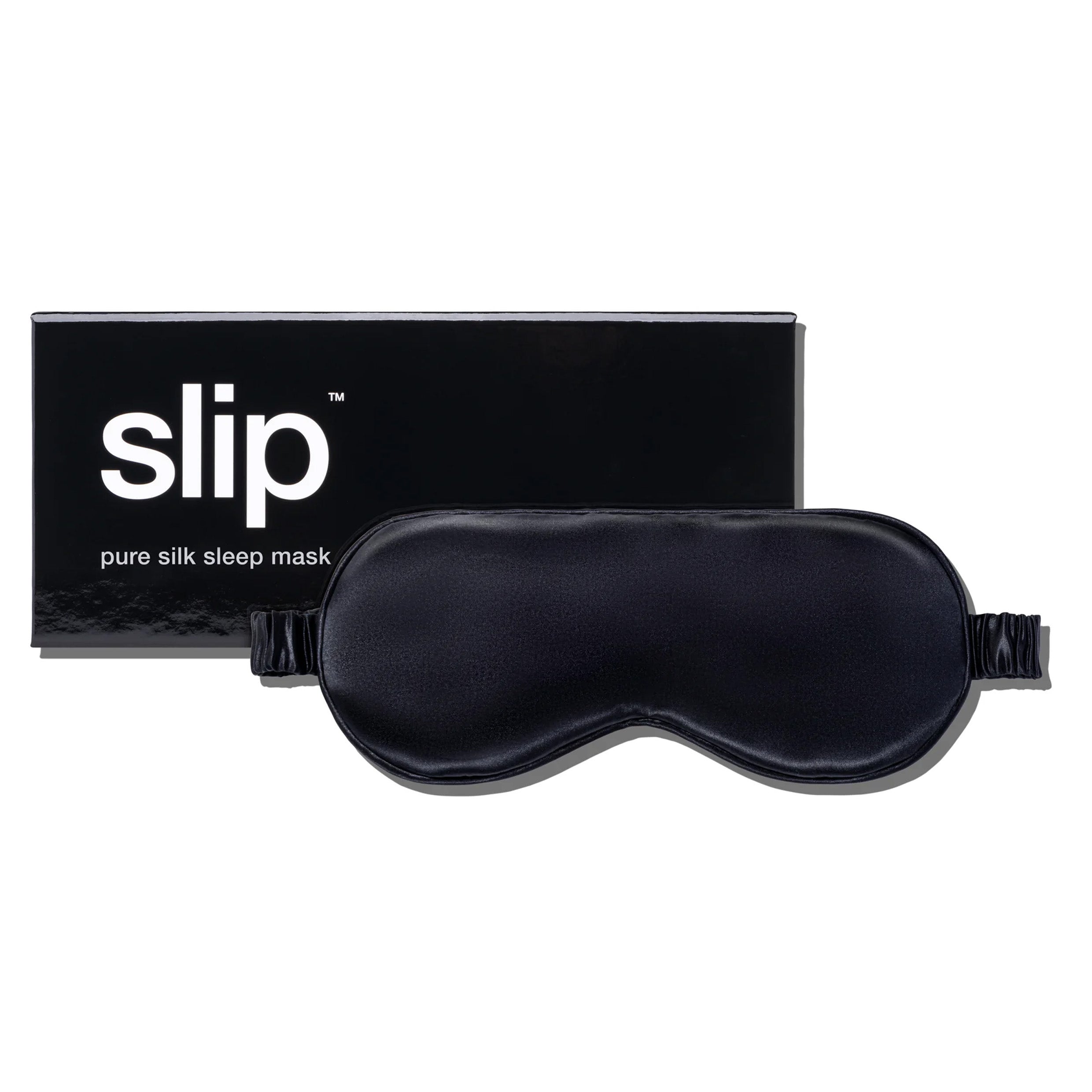 A black sleeping mask next to a black box packaging