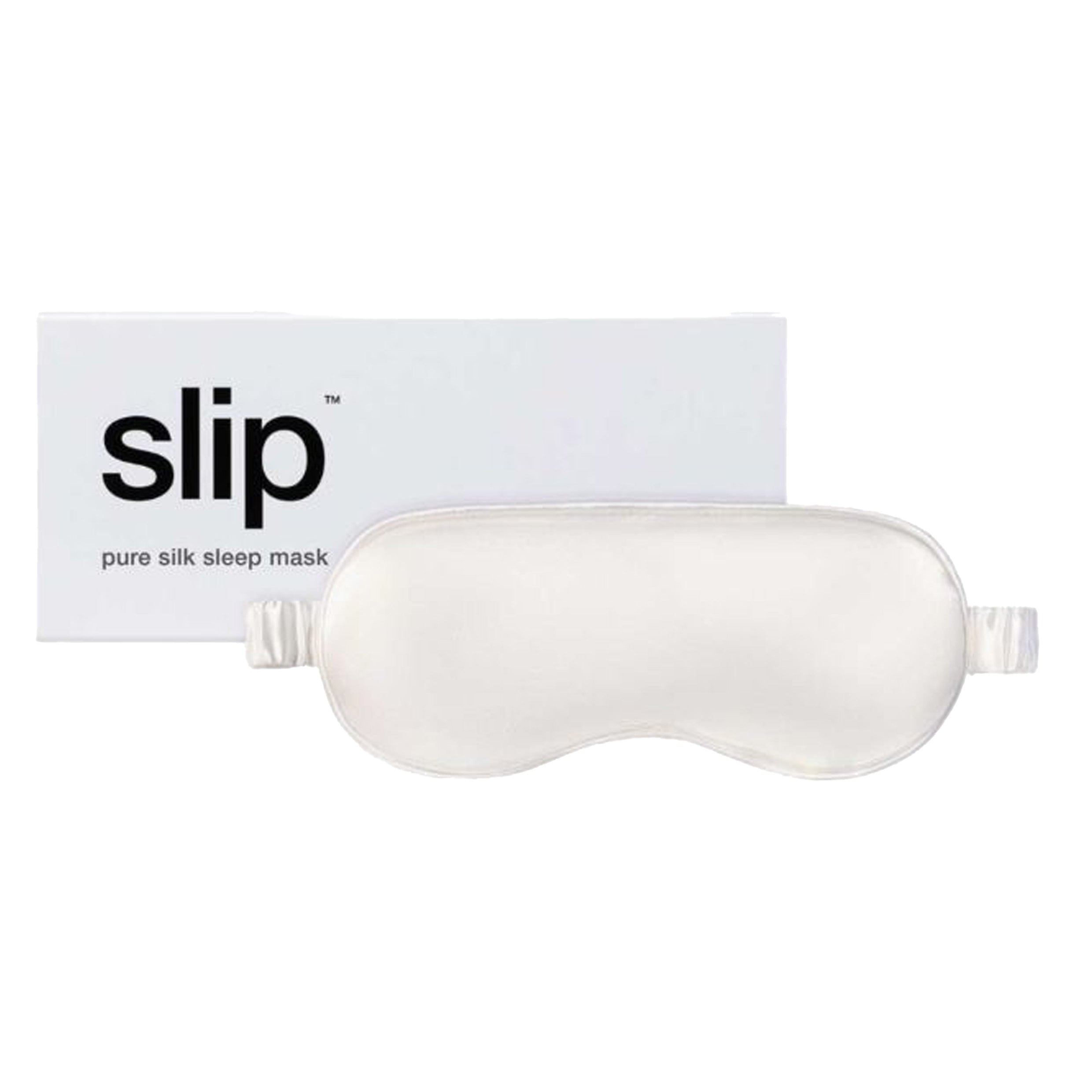 A white silk sleep mask with an elastic band next to white box packaging