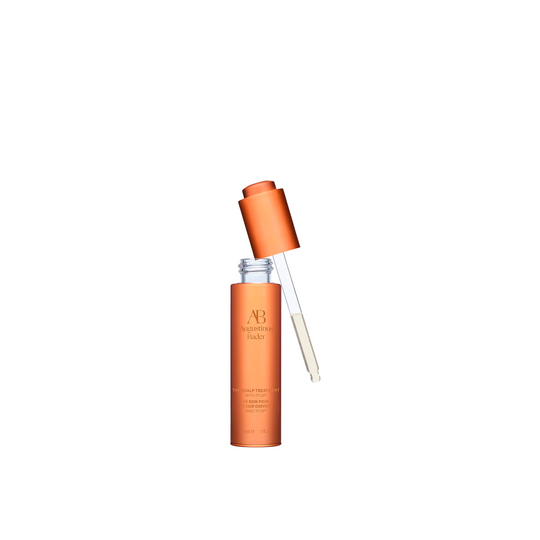 
A bottle of Augustinus Bader The Scalp Treatment, showing the dropper when the lid is removed.

