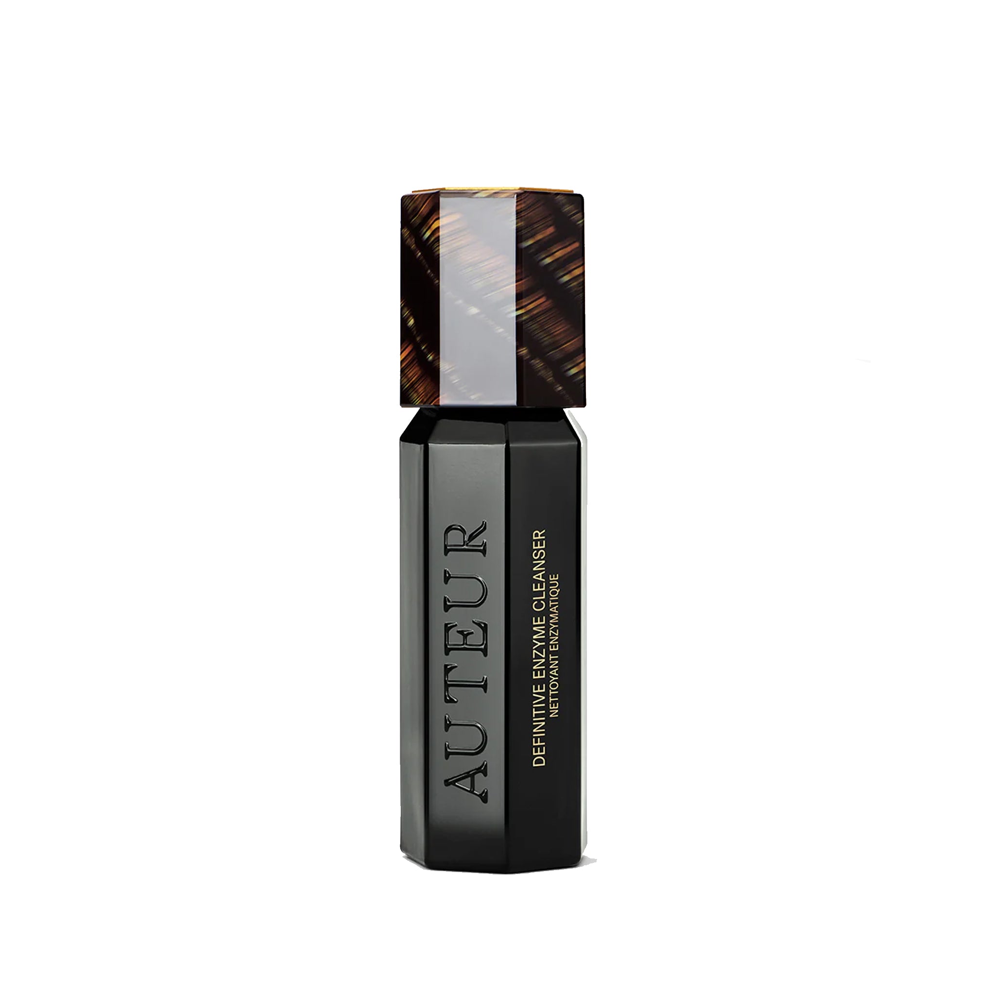 Black skincare product bottle with tortoiseshell cap on a white background