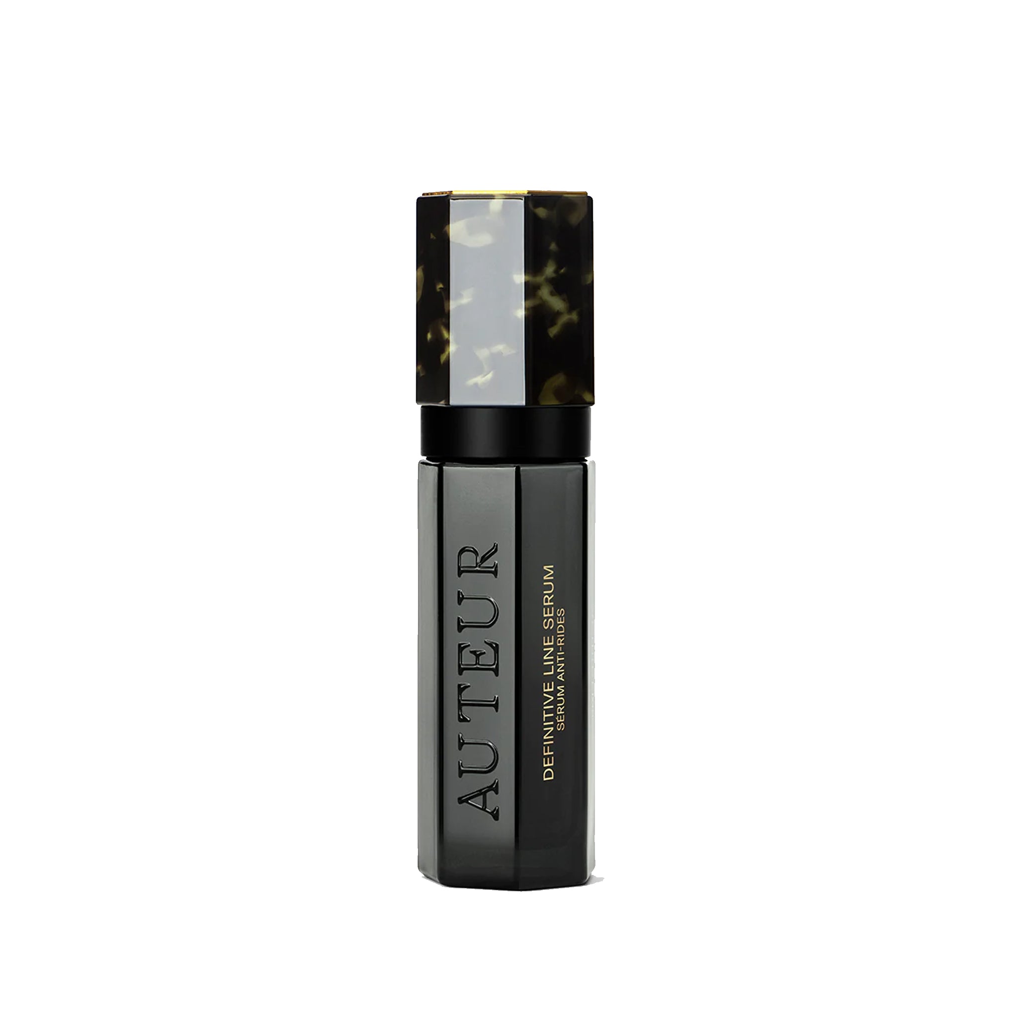 Black serum bottle with tortoiseshell cap on a white background