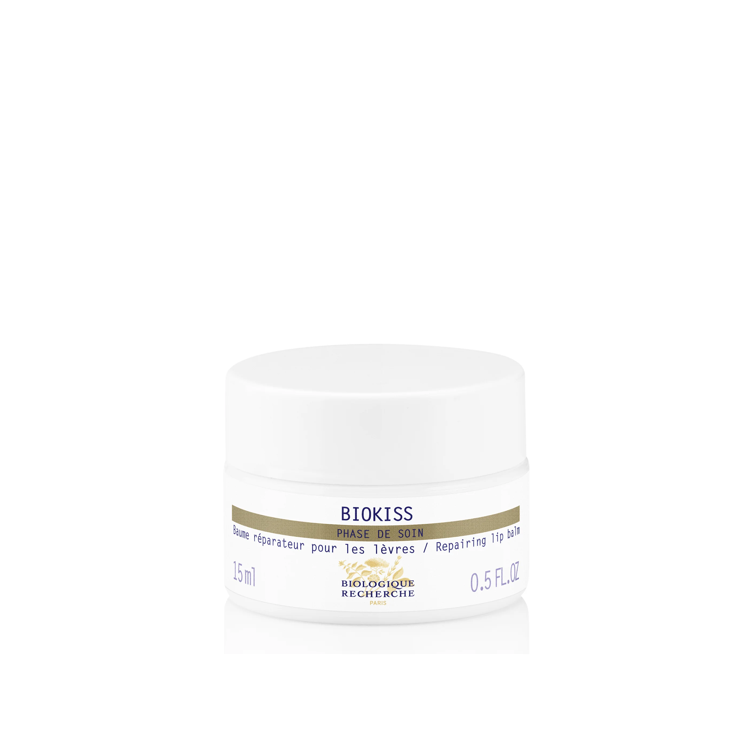 A white jar of Biologique Recherche Biokiss lip balm with product information on the label.