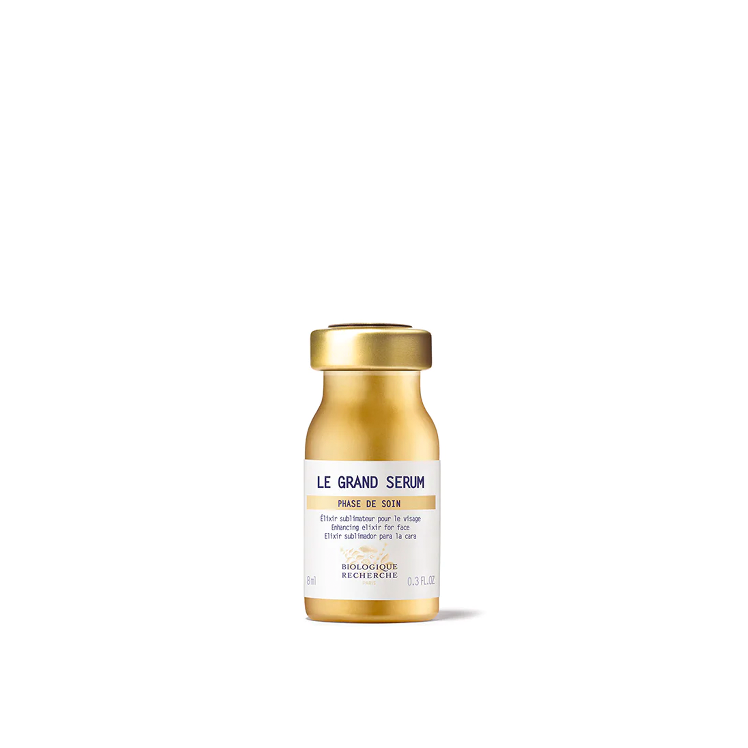 A golden glass bottle of Biologique Recherche Le Grand Serum, presented against a white background.