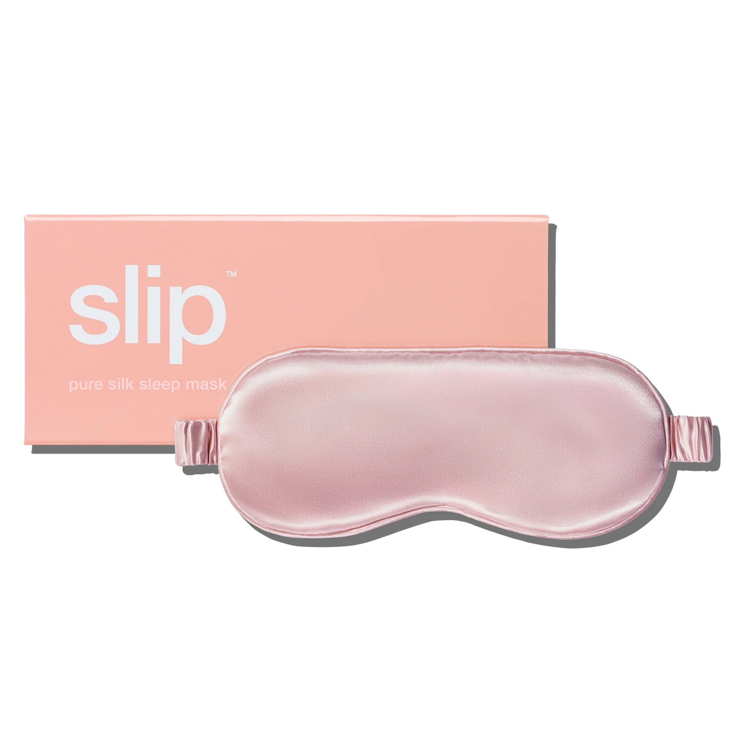 A pink sleeping mask next to pink box packaging
