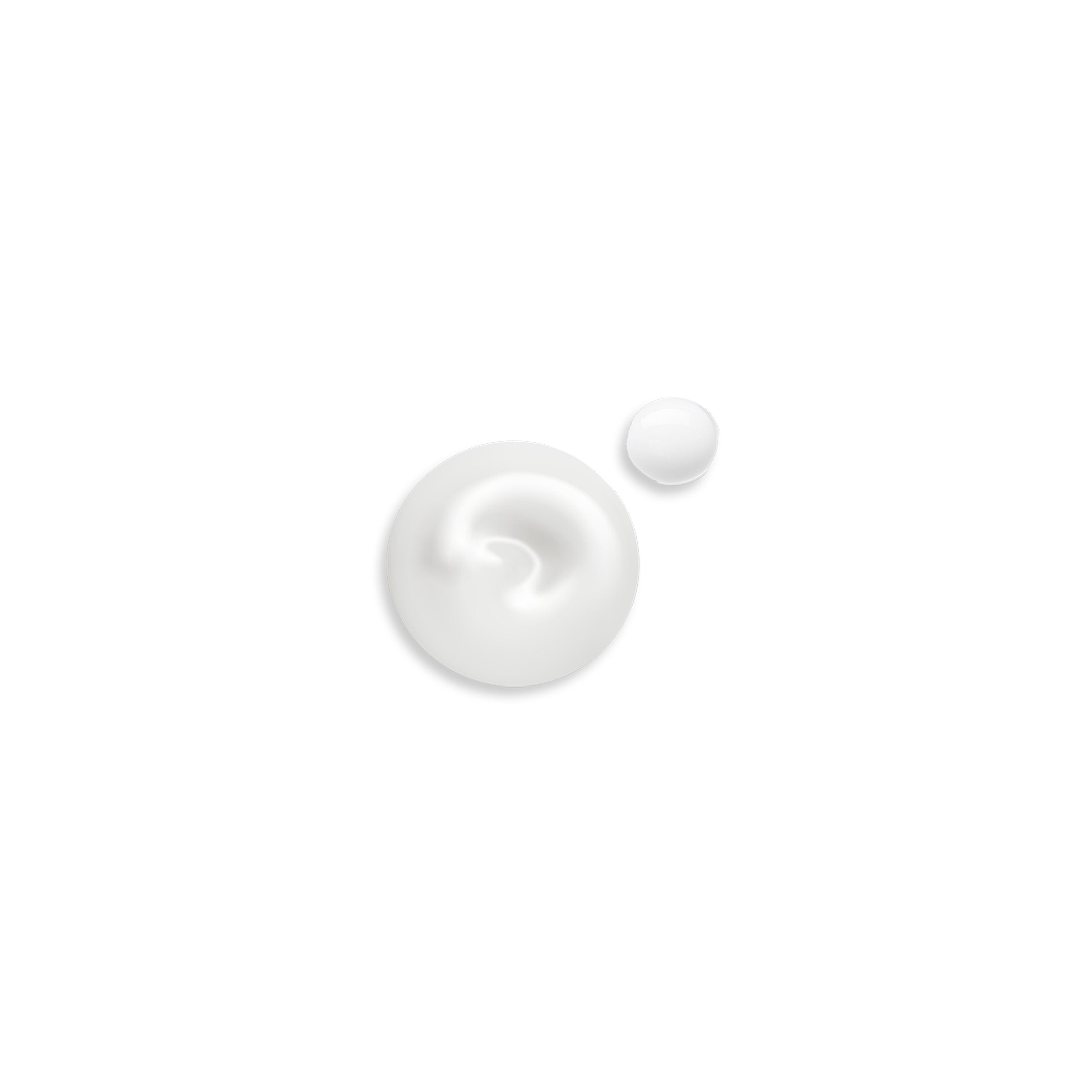 Two droplets of white cream on a light gray background