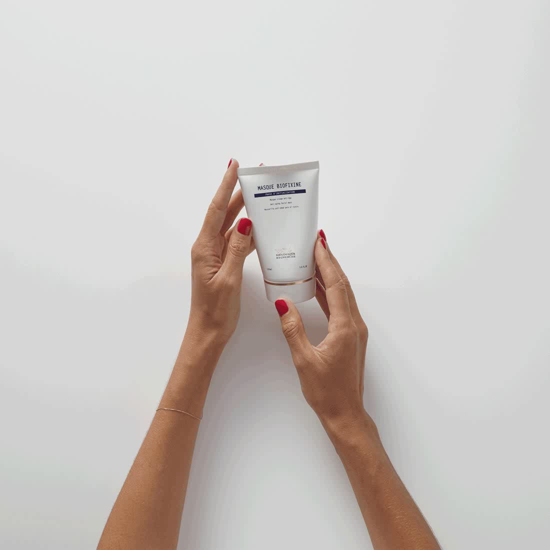 A GIF showing tube of Masque Biofixine