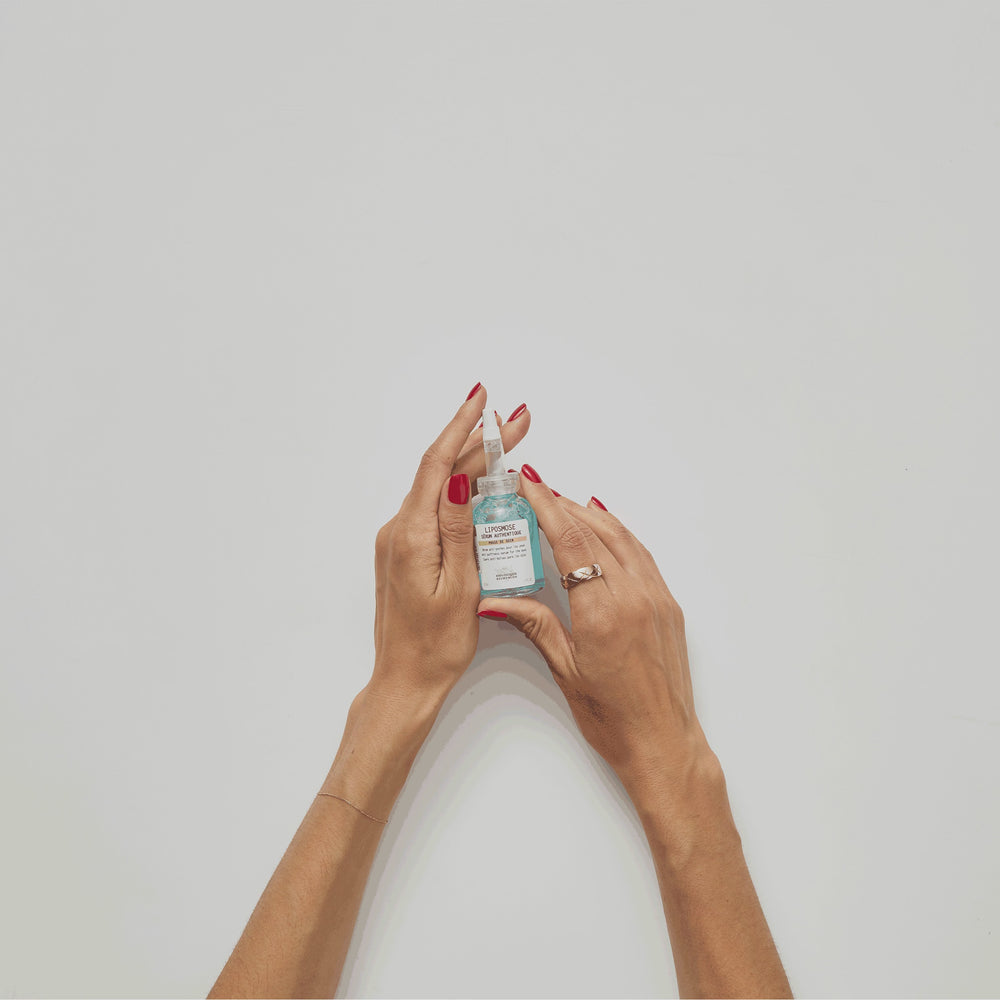 A GIF showing a glass vial of serum